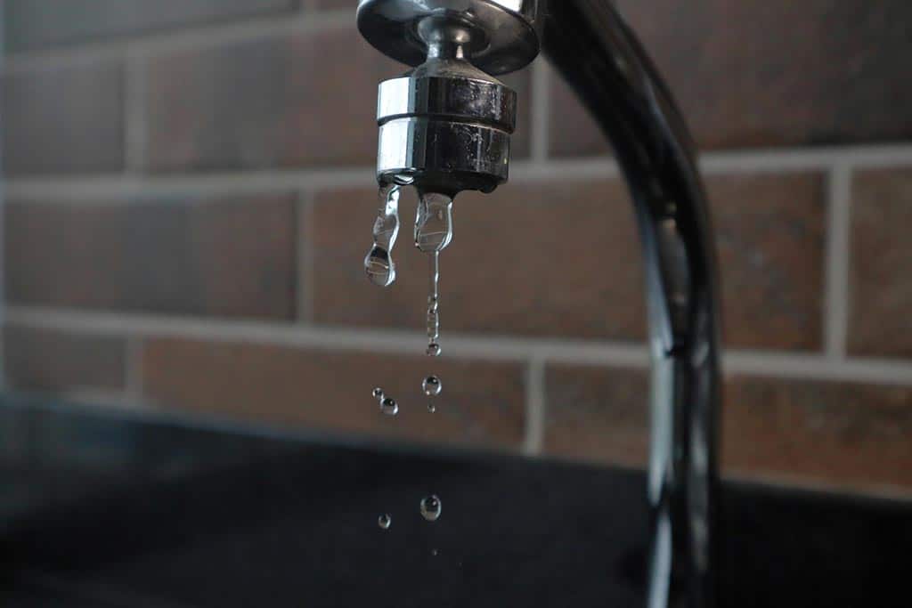 A dripping water tap illustrating the idea of legionella contamination
